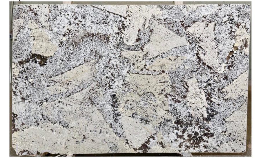 Alpine granite slab, white background with black and brown angular speckling