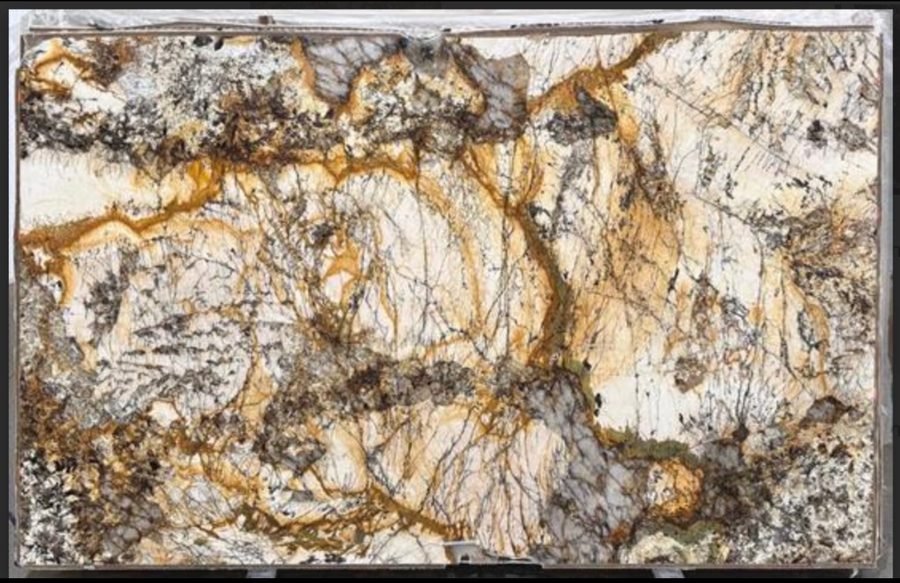 Golden Treasure granite slab, cream and white with heavy rust colored veining
