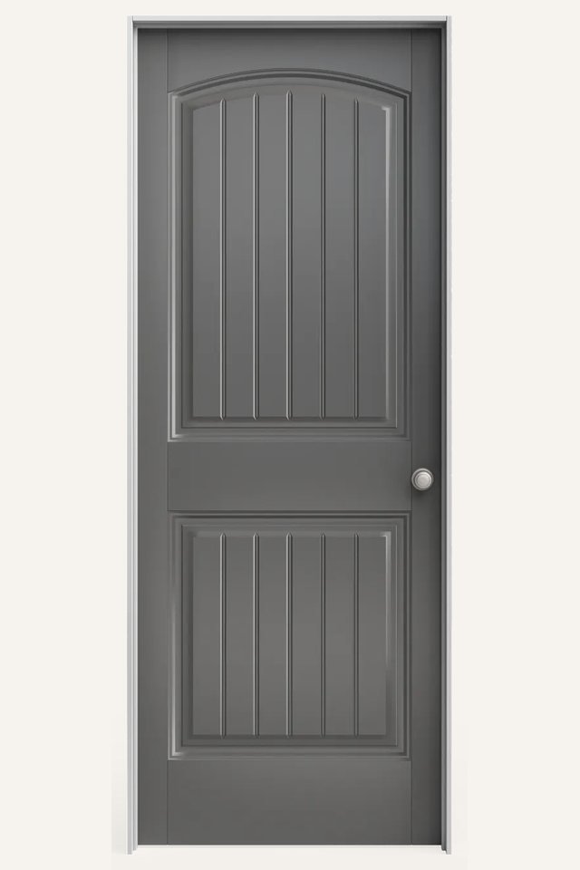 Frontal view of a closed interior 2 gray panel door with an arched top panel and each panel broken into 6 smaller panels, with a silver round handle on the right side.