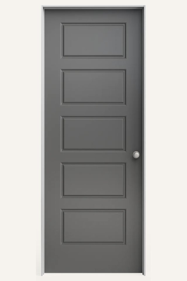 Frontal view of a closed interior 5 gray traditional panel door,with a silver round handle on the right side.