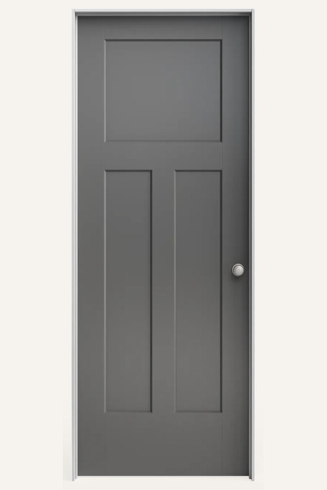 Frontal view of a closed interior 3 gray transitional panel door, with a silver round handle on the right side.