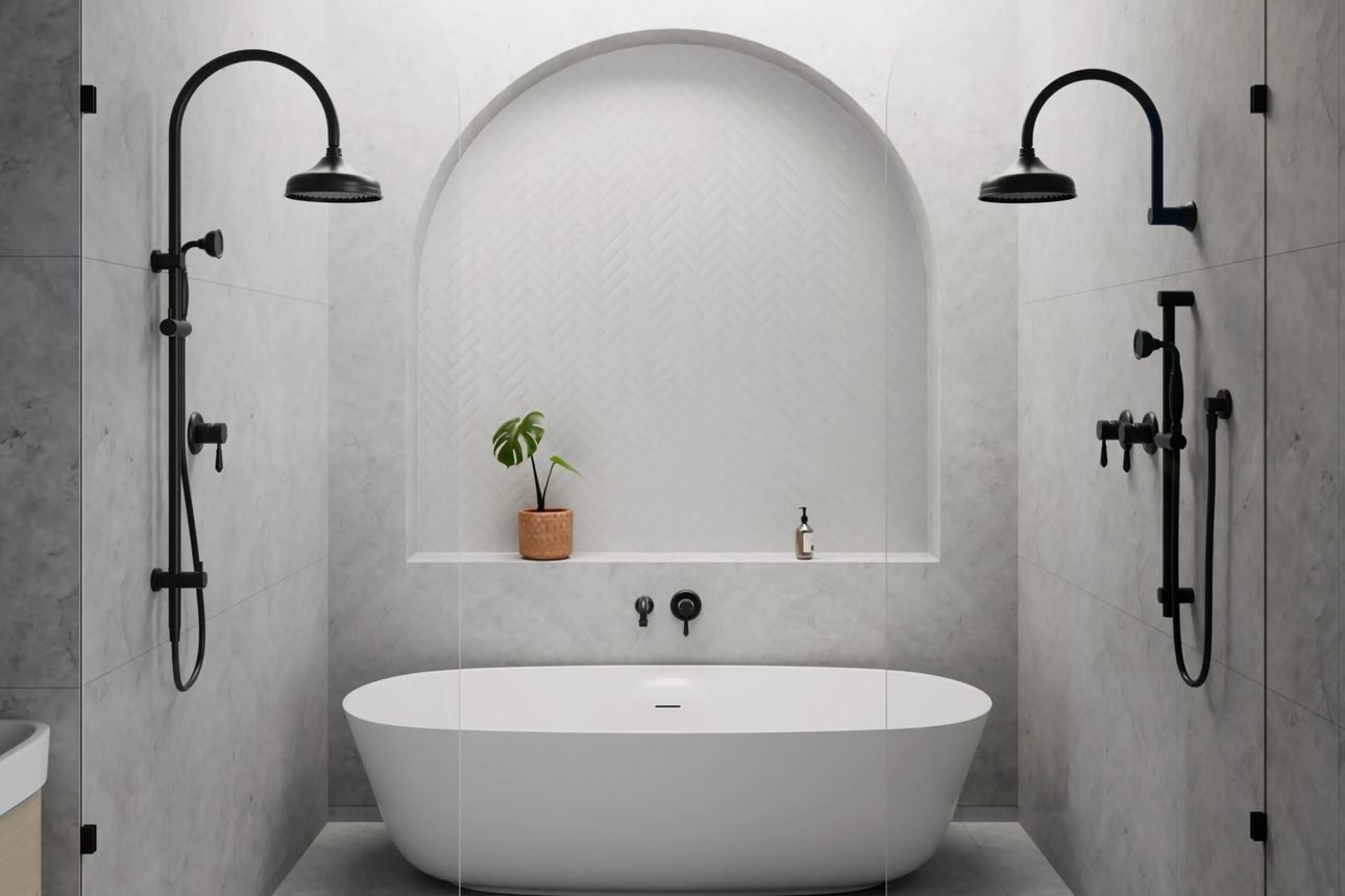 A stone lined wet room with two matte black exposed shower systems flanking an arched fluted niche, around a white freestanding tub